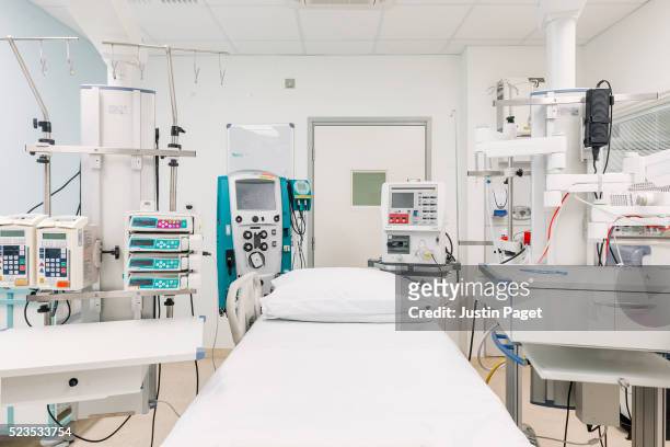 empty intensive care bed in uk hospital - intensive care unit stock pictures, royalty-free photos & images