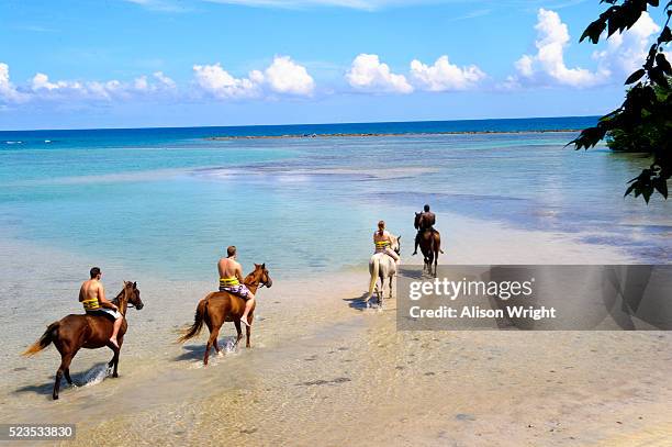 chukka caribbean adventures, jamaica. - mother and child in water at beach stock pictures, royalty-free photos & images