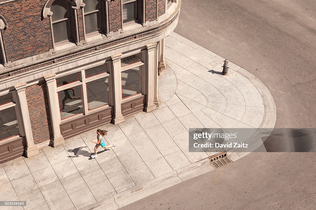 Woman running on the sidewalk