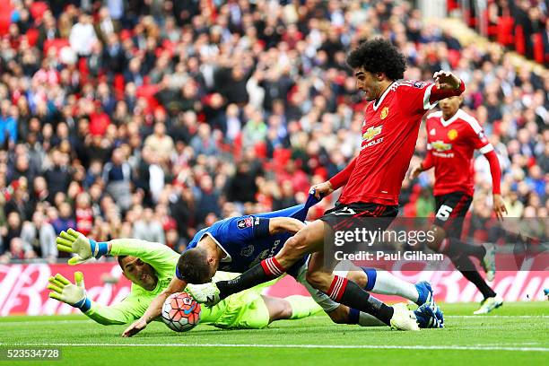 Marouane Fellaini of Manchester United's shot is blocked by Phil Jagielka and Joel Robles of Everton during The Emirates FA Cup semi final match...