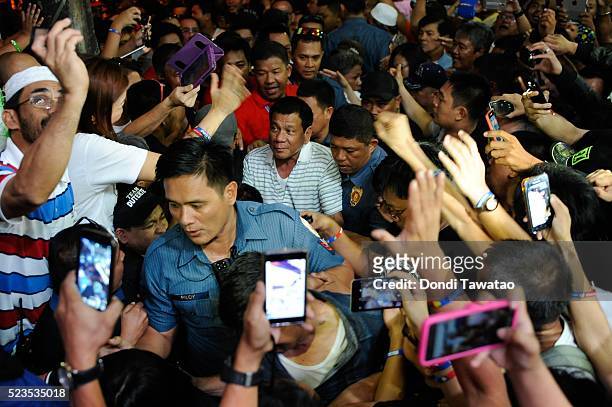 Supporters of Philippine presidential candidate Rodrigo Duterte cheer during a campaign rally on April 23, 2016 in Manila, Philippines. The...