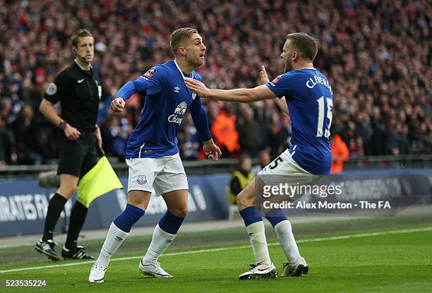 Gerard Deulofeu of Everton celebrates with Tom Cleverley after the own goal scored by Chris Smalling of Manchester United during the Emirates FA Cup...