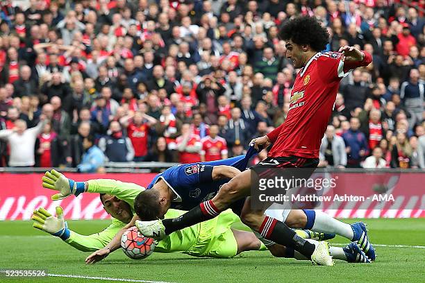 Phil Jagielka of Everton blocks the attempt on goal of Marouane Fellaini of Manchester United during the Emirates FA Cup Semi Final match between...