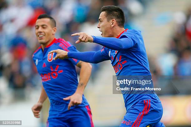 Matias Rodriguez of U de Chile celebrates with his teammates after scoring the first goal against U Catolica during a match between U Catolica and U...