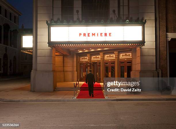 man walking on the red carpet - theater scenery stock-fotos und bilder