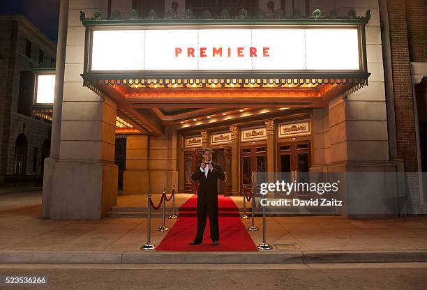 man in a tuxedo standing on the red carpet - actor actress stock pictures, royalty-free photos & images