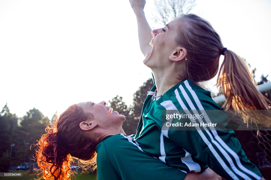 Two female friends cheering
