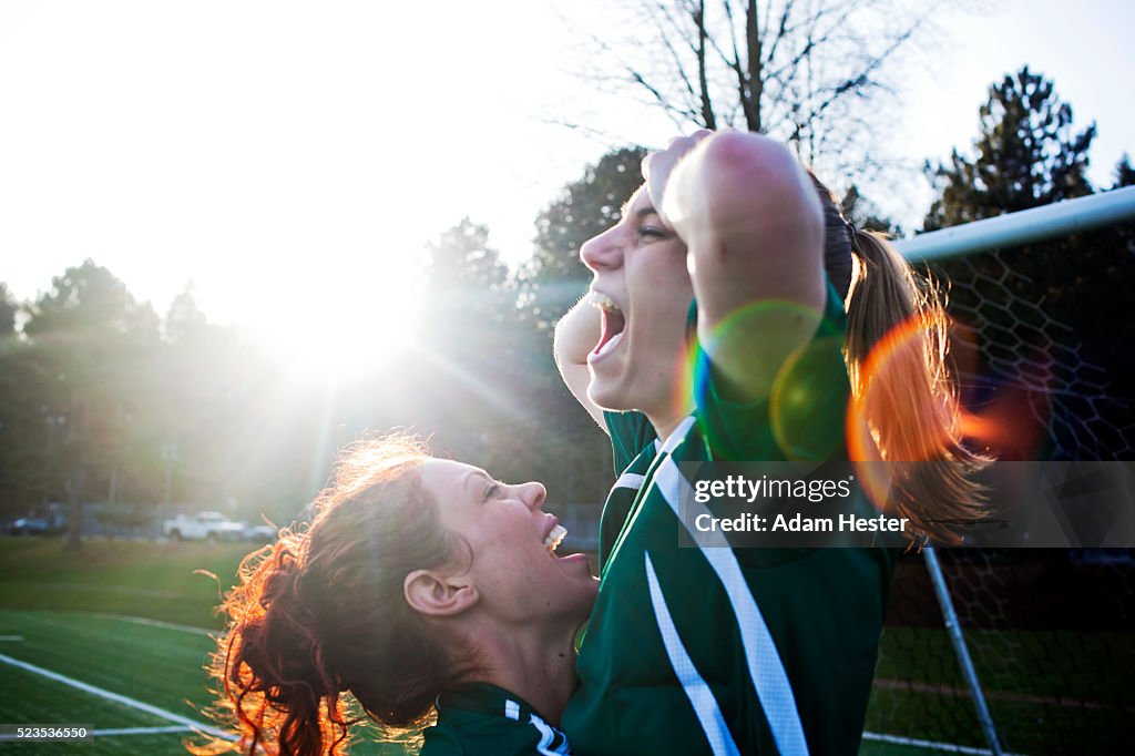 Two female friends cheering