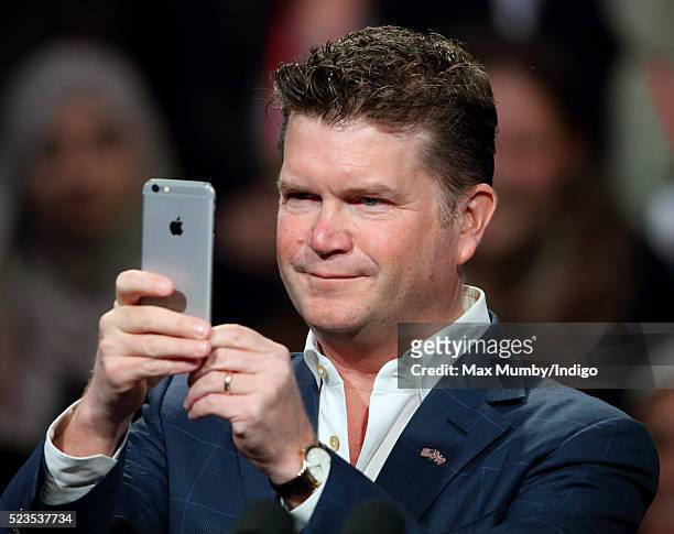 United States Ambassador to the United Kingdom Matthew Barzun takes a photograph using his mobile phone as he attends US President Barack Obama's...