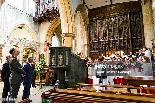 Prince Charles, Prince of Wales listens to the children's choir of Holy Trinity Church on April 23, 2016 in Stratford-upon-Avon, England. Holy...