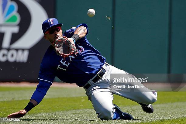Ian Desmond of the Texas Rangers makes a catch for an out during the first inning against the Chicago White Sox at U.S. Cellular Field on April 23,...