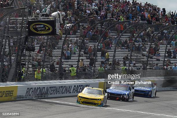 Dale Earnhardt Jr., driver of the Hellmann's Chevrolet, takes the checkered flag to win the NASCAR XFINITY Series ToyotaCare 250 at Richmond...