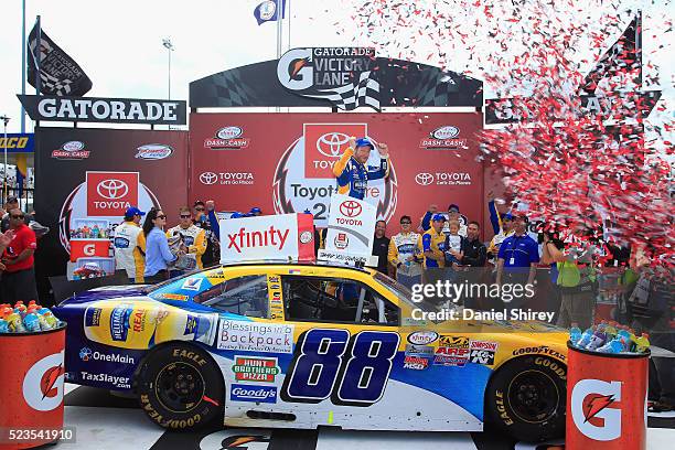 Dale Earnhardt Jr., driver of the Hellmann's Chevrolet, celebrates in Vitory Lane after winning the NASCAR XFINITY Series ToyotaCare 250 at Richmond...