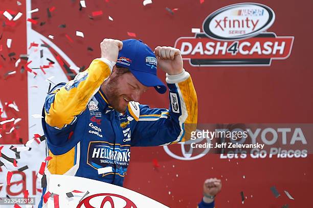 Dale Earnhardt Jr., driver of the Hellmann's Chevrolet, celebrates in Victory Lane after winning the NASCAR XFINITY Series ToyotaCare 250 at Richmond...