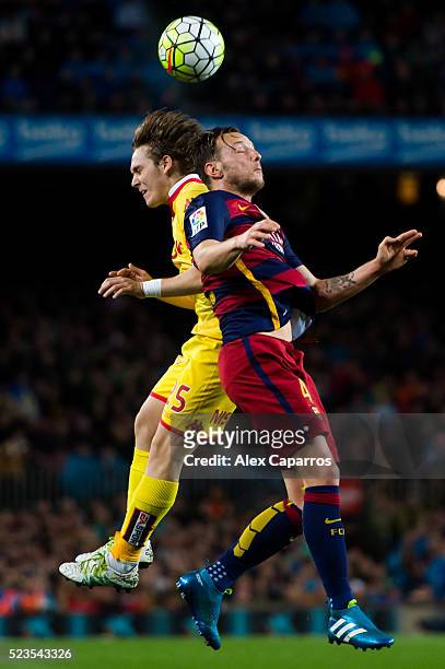 Alen Halilovic of Sporting Gijon and Ivan Rakitic of FC Barcelona compete for the ball during the La Liga match between FC Barcelona and Sporting...