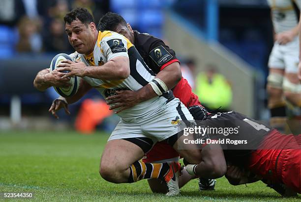 George Smith of Wasps is tackled by Mako Vunipola and Maro Itoje during the European Rugby Champions Cup semi final match between Saracens and Wasps...