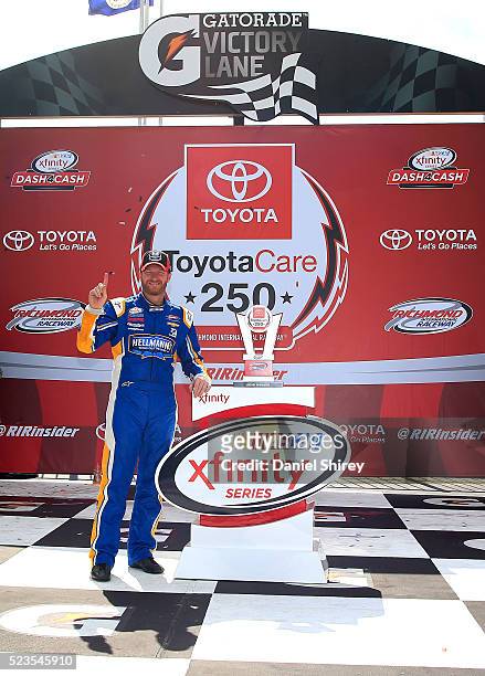 Dale Earnhardt Jr., driver of the Hellmann's Chevrolet, poses for a photo in Victory Lane after winning the NASCAR XFINITY Series ToyotaCare 250 at...