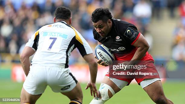 Billy Vunipola of Saracens, takes on George Smith during the European Rugby Champions Cup semi final match between Saracens and Wasps at Madejski...