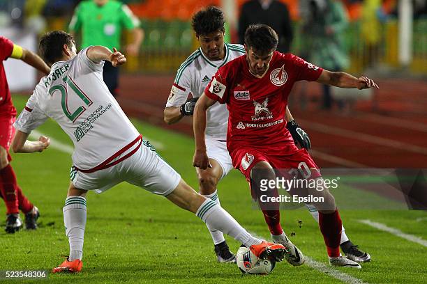 Mijo Cakta of FC Rubin Kazan challenged by Daler Kuzyayev of FC Terek Grozny during the Russian Premier League match between FC Rubin Kazan and FC...
