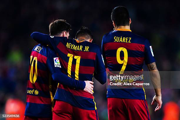 Neymar Santos Jr of FC Barcelona is congratulated by his teammates Luis Suarez and Lionel Messi after scoring his team's fifth goal during the La...