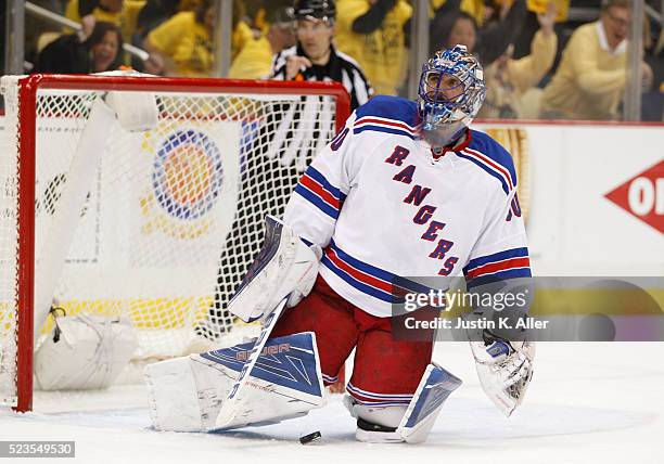 Henrik Lundqvist of the New York Rangers reacts after allowing a goal by Matt Cullen of the Pittsburgh Penguins in the second period in Game Five of...