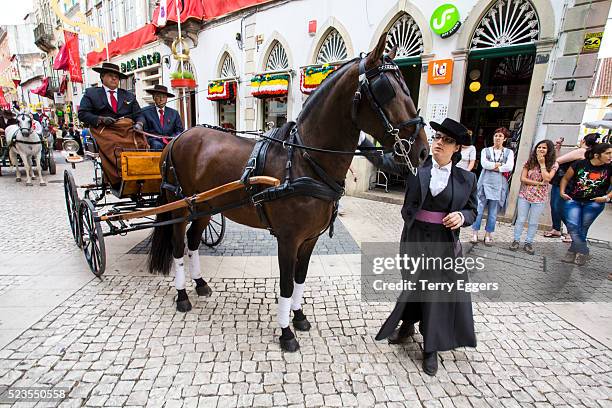 spanish dressed horse back riders leading the procession of the festa dos tabuleiros - tomar stock pictures, royalty-free photos & images