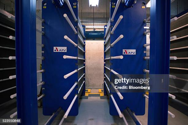 Large plate frame heat exchangers stand at the Enwave Energy Corp. Pumping station in Toronto, Ontartio, Canada, on Friday, April 8, 2016. Enwave...