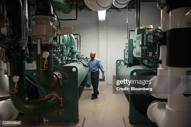 Worker inspects cooling systems at the Enwave Energy Corp. Steam plant in Toronto, Ontartio, Canada, on Friday, April 8, 2016. Enwave Energy Corp....