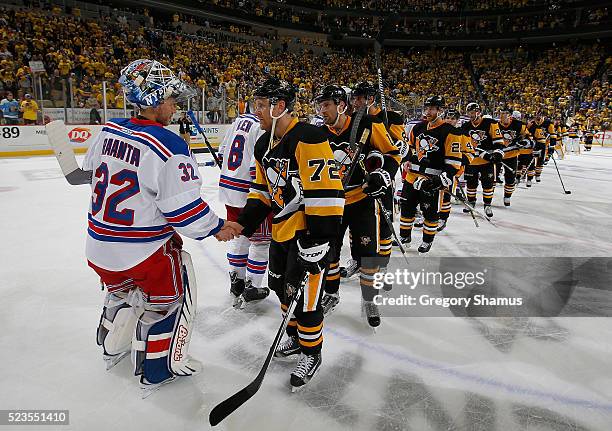 Patric Hornqvist of the Pittsburgh Penguins shakes hands with Antti Raanta of the New York Rangers after a 6-3 win to clinch the series in Game Five...