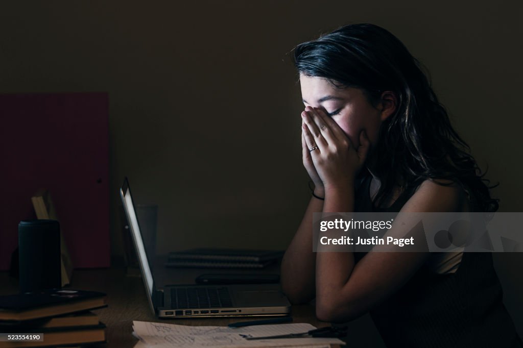 Upset Teenage Girl by Computer