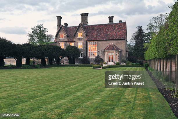 rear elevation of english country home - big house stock-fotos und bilder