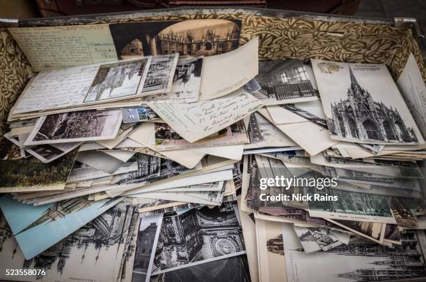 old post cards in the antique market, rouen - cartolina postale foto e immagini stock