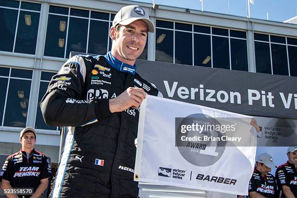 Simon Pagenaud, of France, celebrates after winning the pole position for the Honda Indy Grand Prix of Alabama at Barber Motorsports Park on April...