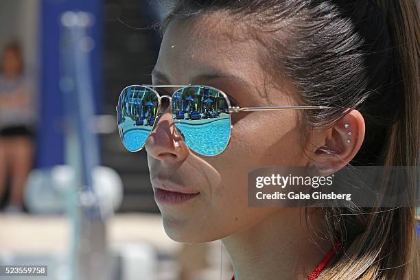 Lifeguard Nia Moreno watches the pool during a fight weekend pool party at Sky Beach Club at the Tropicana Las Vegas on April 23, 2016 in Las Vegas,...