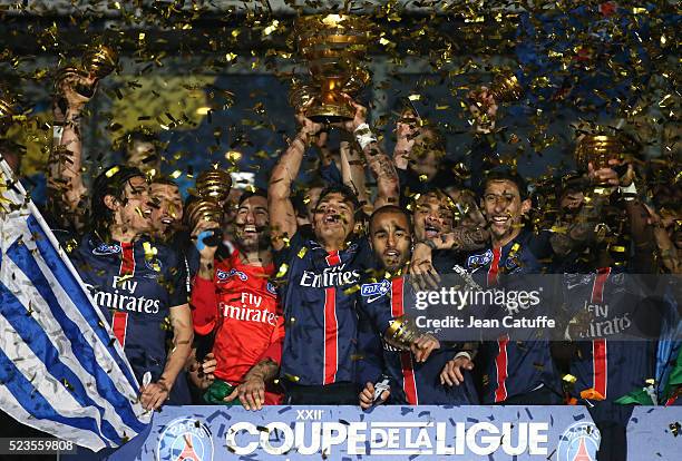 Thiago Silva of PSG holds the trophy while celebrating with teammates Edinson Cavani, Salvatore Sirigu, Lucas Moura, Angel Di Maria winning the...