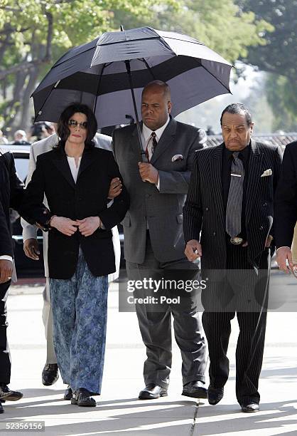Michael Jackson and his father Joseph Jackson enters the court house after arriving late at Santa Barbara County Superior Court on March 10, 2005 in...