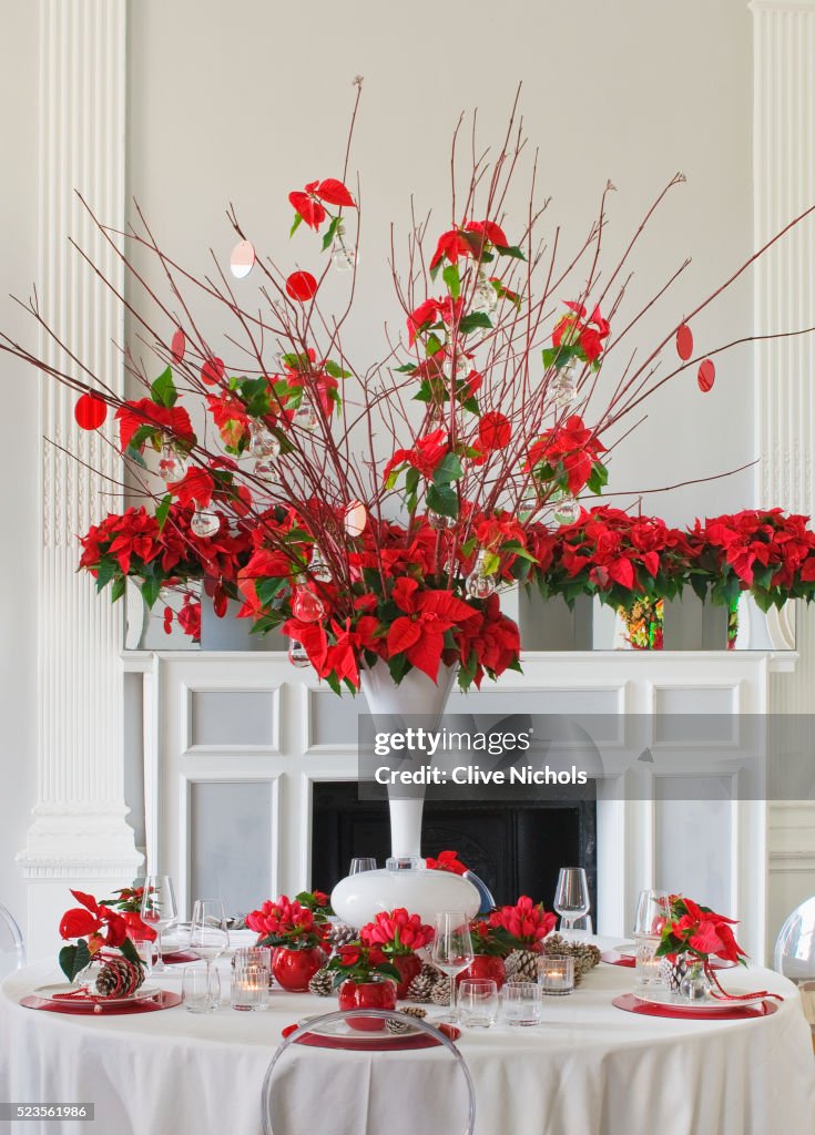 Dining table decorated with poinsettias