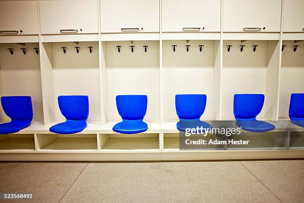 the inside of a locker room in a soccer stadium. - locker room stock pictures, royalty-free photos & images