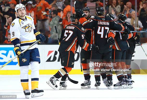 Filip Forsberg of the Nashville Predators looks on dejectedly as David Perron of the Anaheim Ducks celebrates second period goal with teammates Ryan...