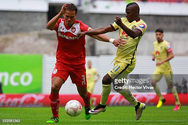 Aaron Galindo of Toluca struggles for the ball with Darwin Quintero of America during the 15th round match between America and Toluca as part of the...