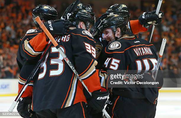 Sami Vatanen of the Anaheim Ducks smiles as he celebrates with Jakob Silfverberg and his Ducks teammates after scoring on a breakaway against...