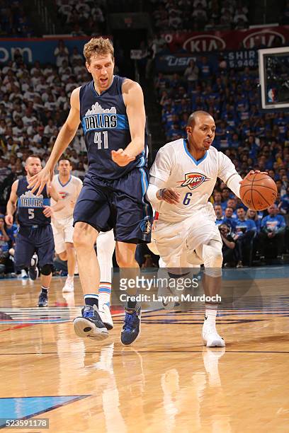 Randy Foye of the Oklahoma City Thunder handles the ball during the game against Dirk Nowitzki of the Dallas Mavericks in Game One of the Western...