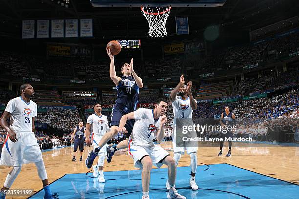 Dirk Nowitzki of the Dallas Mavericks goes for the layup during the game against the Oklahoma City Thunder during Game One of the NBA Playoffs on...