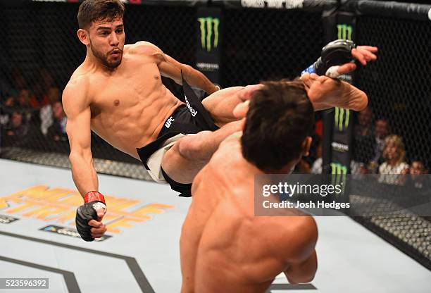 Yair Rodriguez of Mexico kicks Andre Fili in their featherweight bout during the UFC 197 event inside MGM Grand Garden Arena on April 23, 2016 in Las...