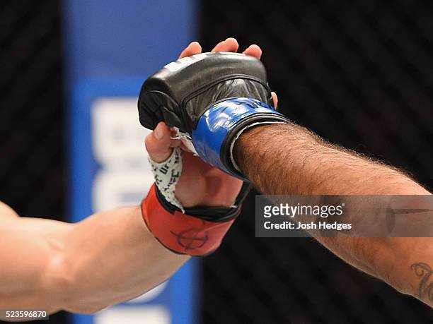 Robert Whittaker of New Zealand and Rafael Natal touch gloves before their middleweight bout during the UFC 197 event inside MGM Grand Garden Arena...