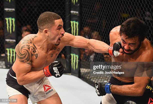 Robert Whittaker of New Zealand punches Rafael Natal in their middleweight bout during the UFC 197 event inside MGM Grand Garden Arena on April 23,...