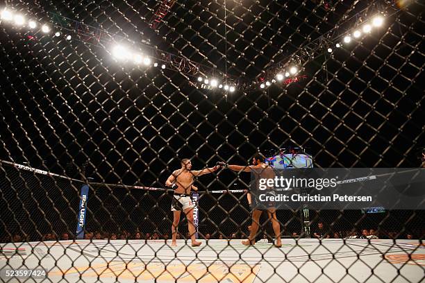 Robert Whittaker of New Zealand and Rafael Natal touch gloves before a round in their middleweight bout during the UFC 197 event inside MGM Grand...