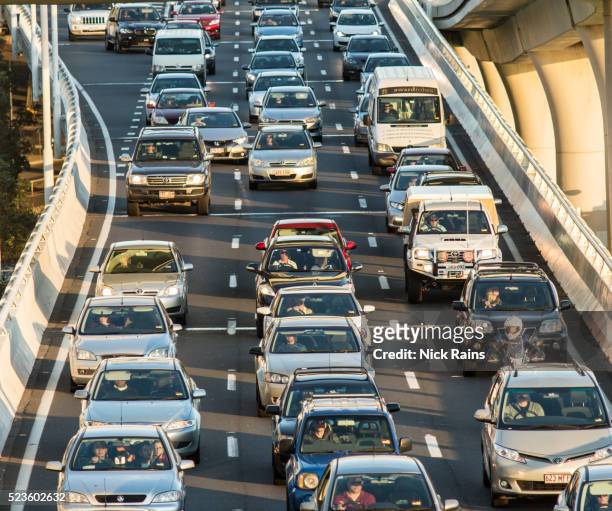 city traffic congestion - moving a motorized vehicle stockfoto's en -beelden