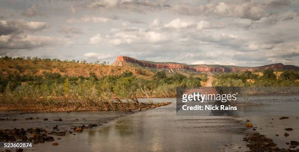 crossing the flooded pentacost river, kimberley - western australia road stock pictures, royalty-free photos & images