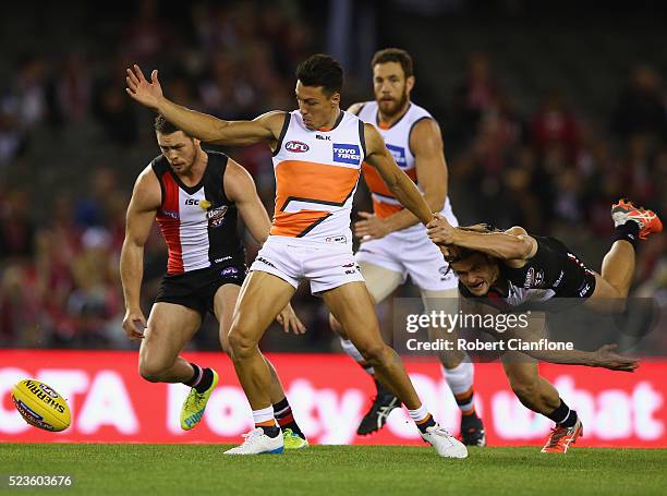 Dylan Shiel of the Giants is challenged by Marverick Weller of the Saints during the round five AFL match between the St Kilda Saints and the Greater...